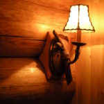 Installed sconse on log wall
