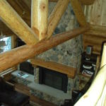 Looking down from loft, great room stone fireplace