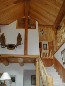 Looking up at the loft area from living room