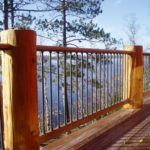Ipe decking and railing with log posts and aluminum ballisters