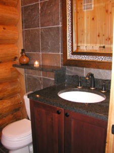 Powder room, granite, tile and log