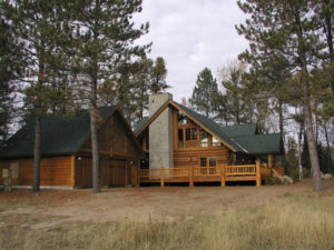 Cedar log home, stone chimney