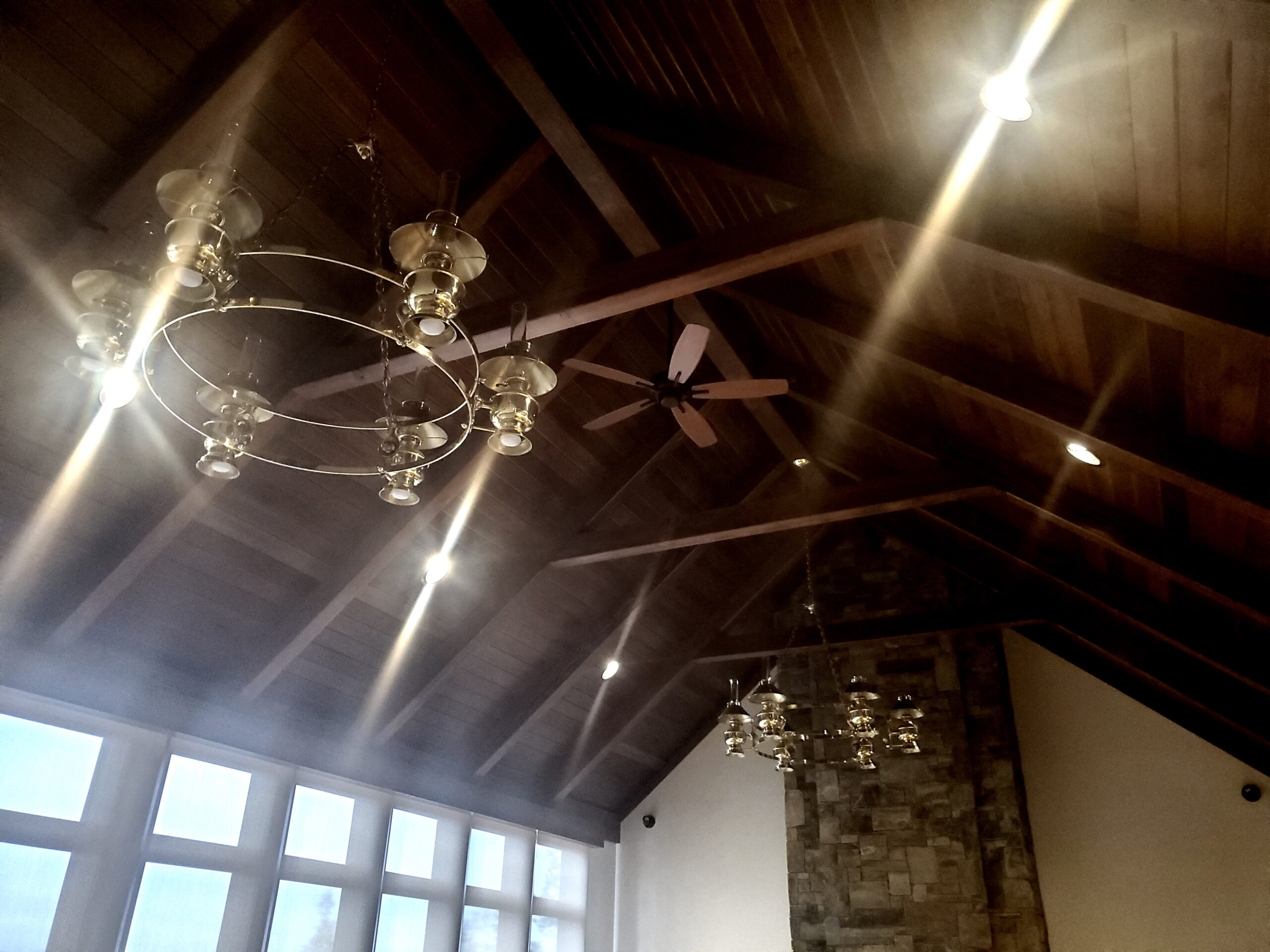Great rm timber Ceiling timbers and Chandeliers in great room