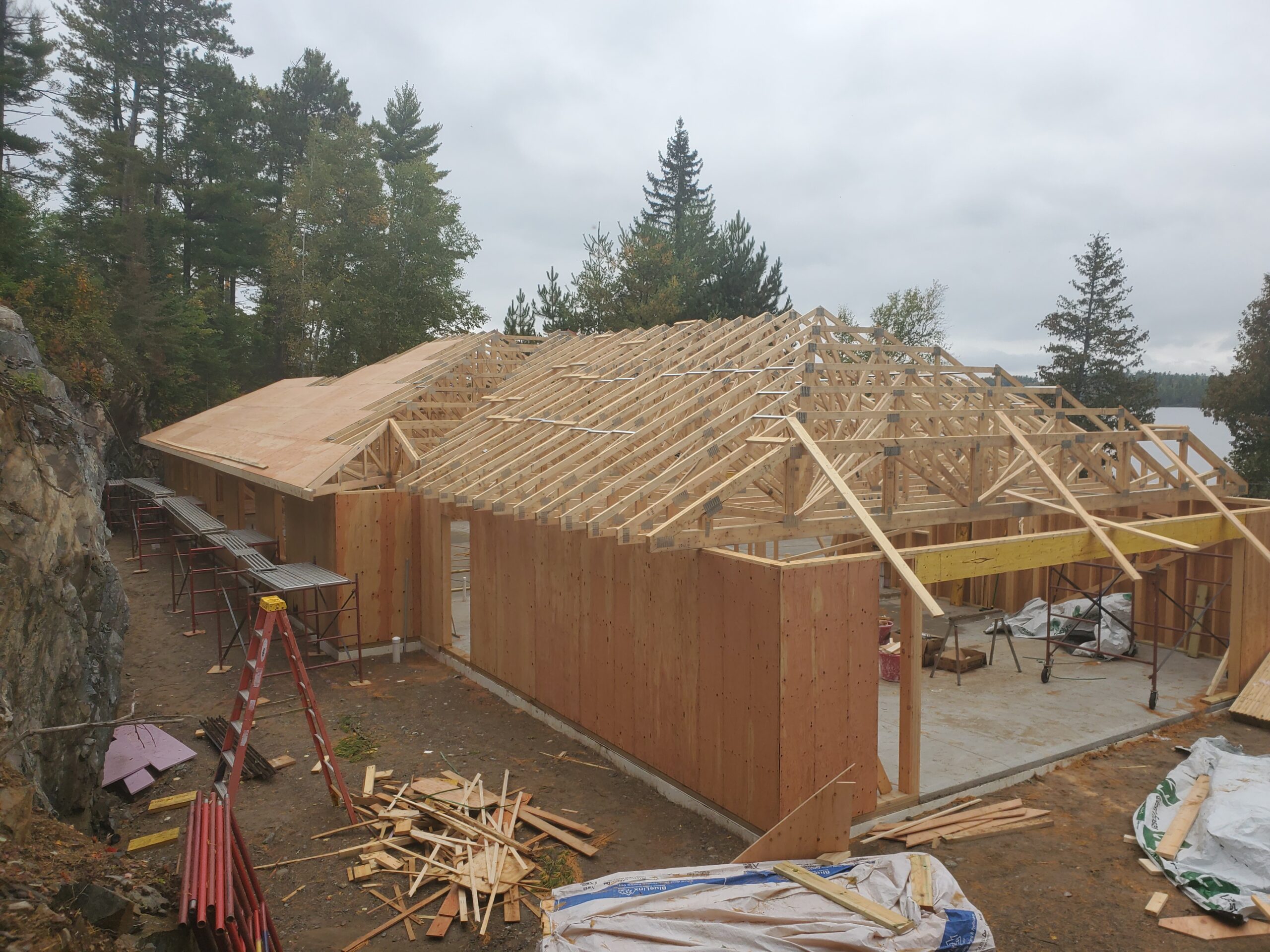 Start sheeting Trusses almost done, sheathing started, custom home Huisman Concepts